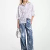 Von Hand bespritzte Jeans mit weitem Bein aus gebleichtem Denim